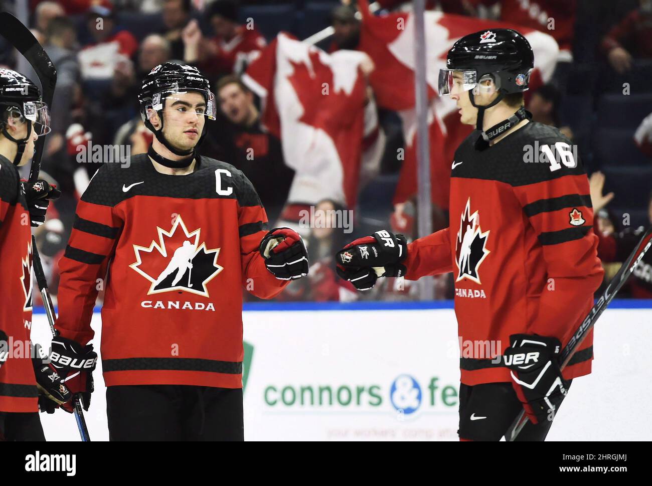 Canada's Dillon Dube, left, celebrates a goal against Switzerland with Taylor Raddysh (16) during third period quarter-final IIHF World Junior Championships hockey action in Buffalo, N.Y. on Tuesday, January 2, 2018. A change of scenery seems to be reinvigorating hockey fans' interest in an annual holiday tradition.Ticket demand for the 2019 International Ice Hockey Federation's World Junior Championship in Vancouver and Victoria has 'exceeded expectations,' said Riley Wiwchar, director of the tournament.THE CANADIAN PRESS/Nathan Denette Stock Photo