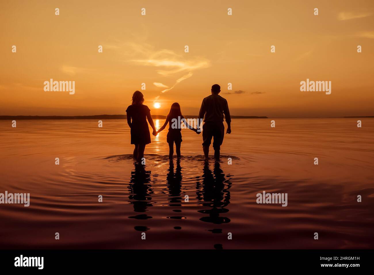 Children holding hands silhouette hi-res stock photography and images ...
