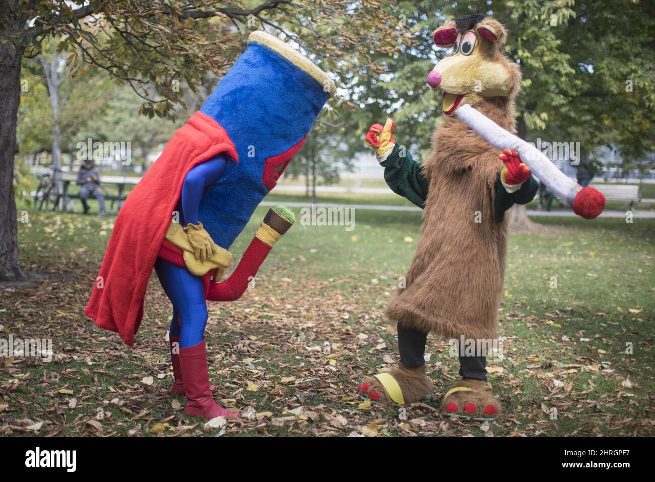 Two costumed figures, including Tokaroo, right, mark the first day of legalization of cannabis across Canada in a Toronto park on Wednesday, October 17, 2018. Mascot maker Mark Scott says he will not buckle to legal threats from Ontario's public broadcaster over his pothead parody of the beloved children's TV character Polkaroo. THE CANADIAN PRESS/Chris Young Stock Photo