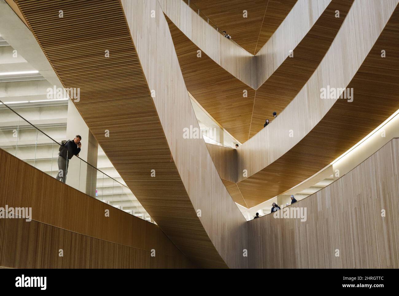Visitors explore the new Calgary Library following its opening in ...