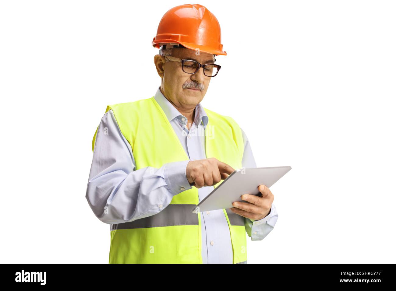 Mature construction site engineer using a tablet isolated on white background Stock Photo