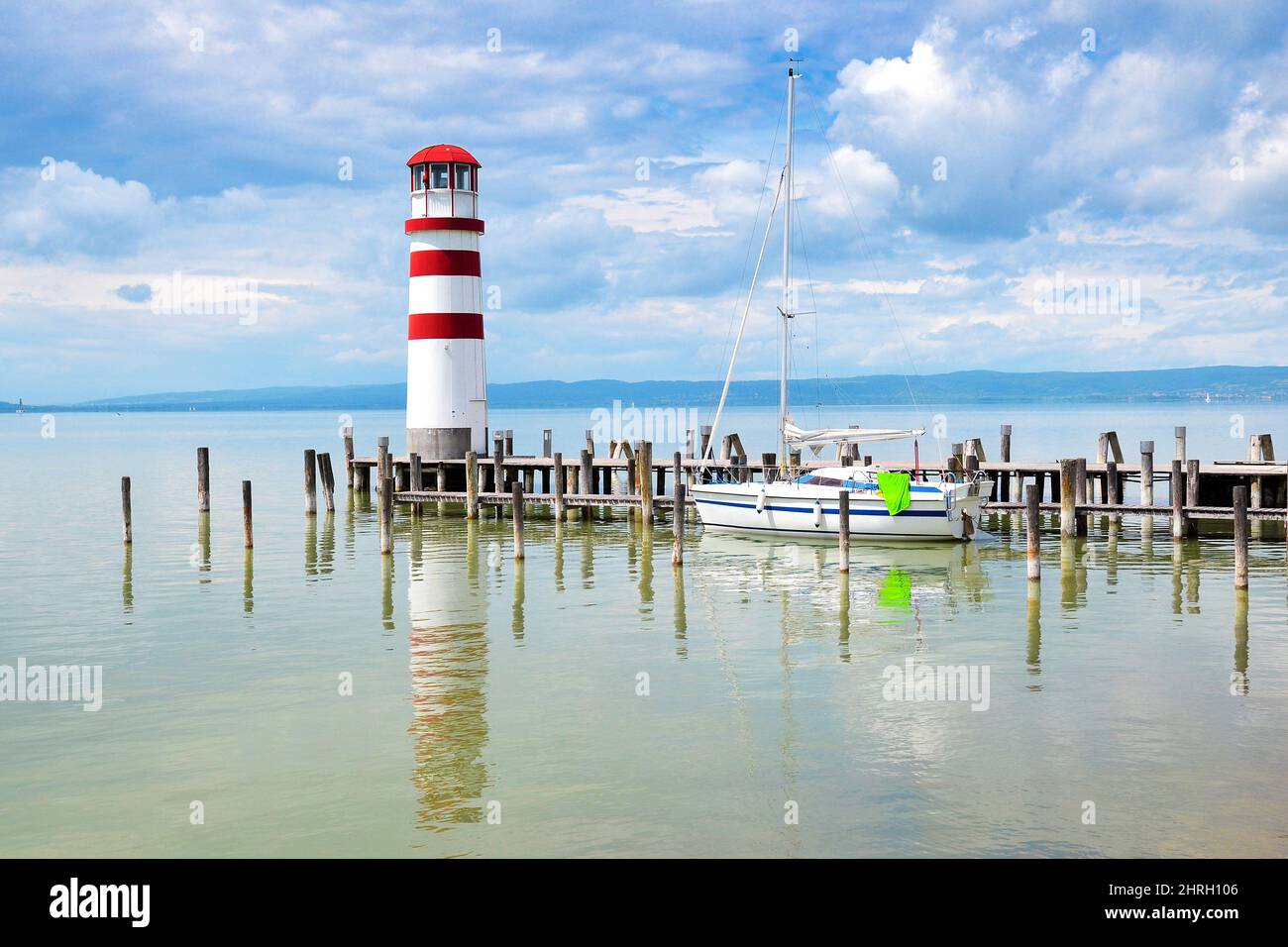 Lighthouse with wooden pier in Podersdorf am See, a small village on Lake Neusiedler with the longest beach in Burgenland, Austria. Stock Photo