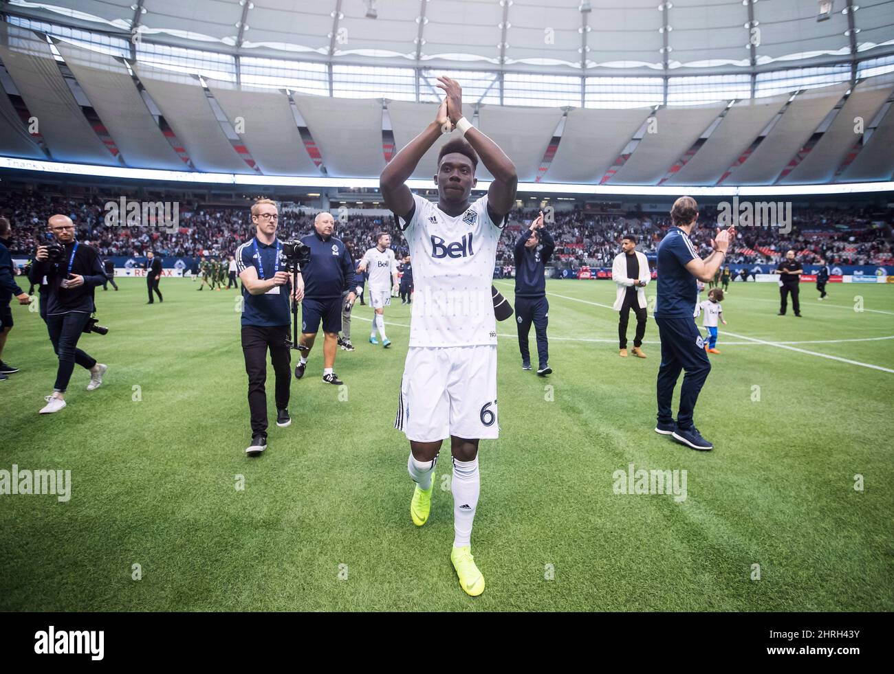 Vancouver Whitecaps midfielder Alphonso Davies salutes the crowd after playing his final match as a member of the MLS soccer team, in Vancouver, on October 28, 2018. Canada captains Scott Arfield and Christine Sinclair join Bayern Munich teenager Alphonso Davies and Manchester City striker Janine Beckie in a deep pool of candidates for the Canada Soccer Player of the Year Awards. THE CANADIAN PRESS/Darryl Dyck Stock Photo