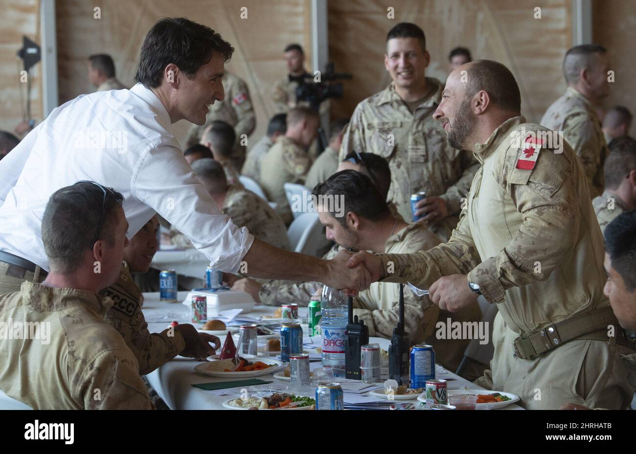 Canadian Prime Minister Justin Trudeau shakes hands with members of the ...