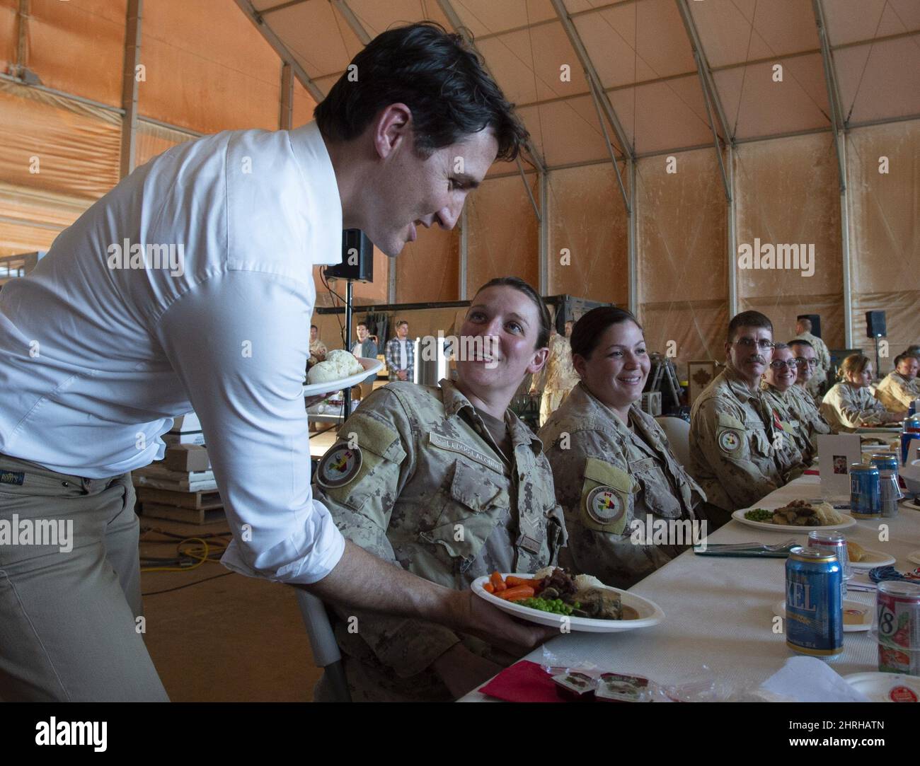 Canadian Prime Minister Justin Trudeau serves turkey dinner to members ...