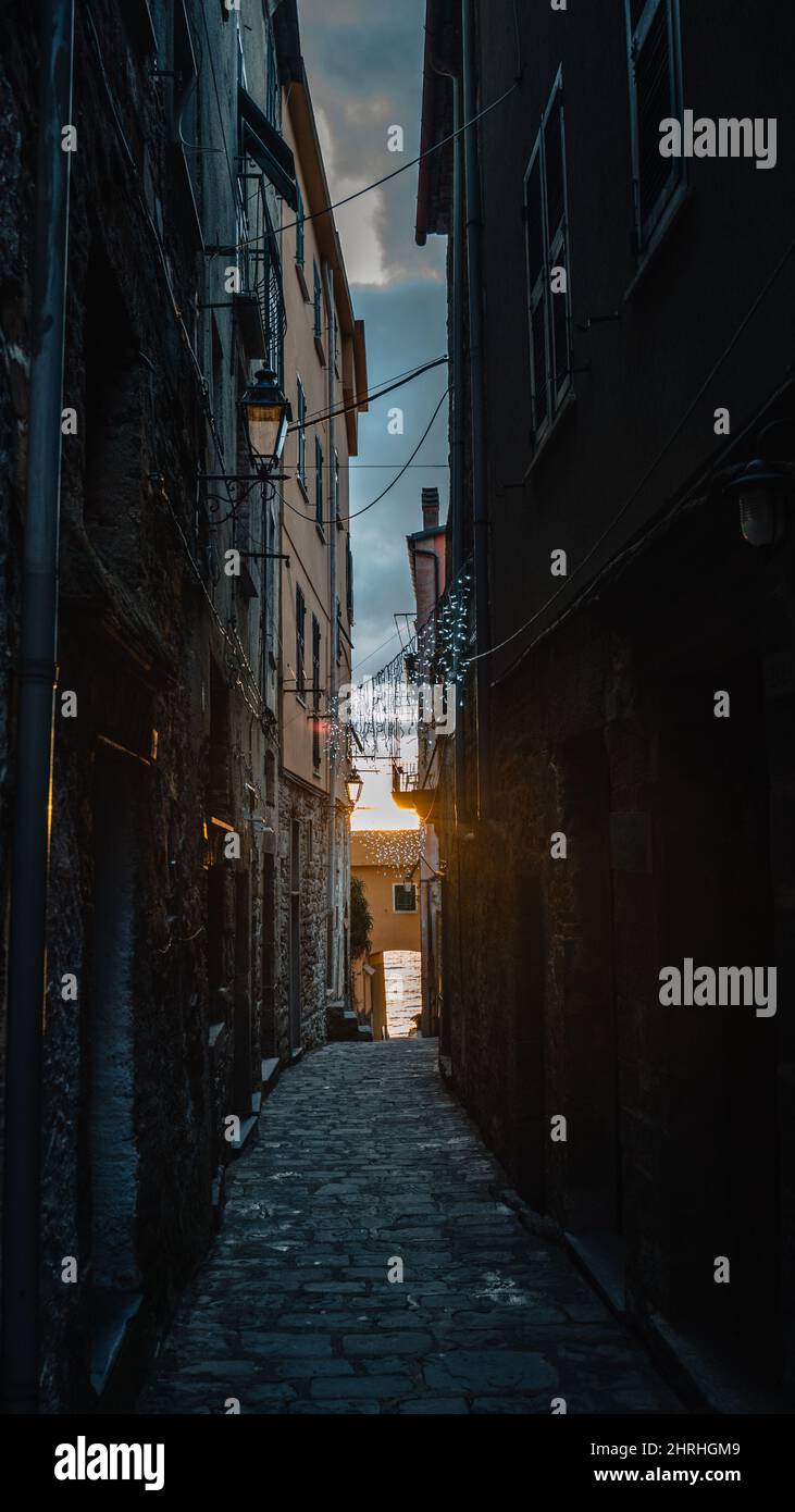 Vertical shot of a path in the middle of buildings in Rome Stock Photo ...