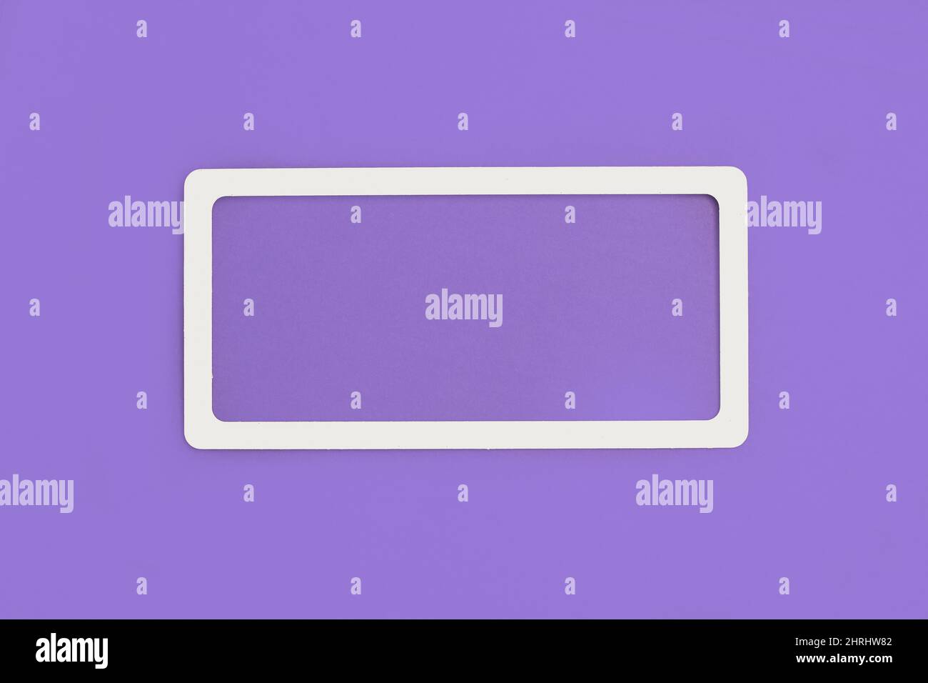 A white frame on a violet background with copy space Stock Photo