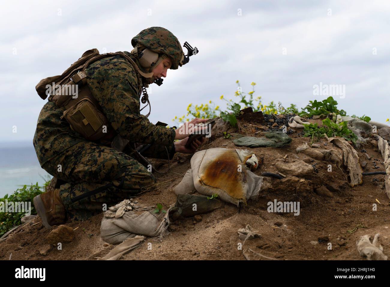 Iirusna, Okinawa, Japan. 16th Feb, 2022. U.S. Marine Corps Maj. Jessica Lucia, air officer, 12th Marines, collects targeting data for an indirect fire mission during Jungle Warfare Exercise 22 off the coast of Okinawa, Japan, Feb. 16, 2022. JWX 22 is a large-scale field training exercise focused on leveraging the integrated capabilities of joint and allied partners to strengthen all-domain awareness, maneuver, and fires across a distributed maritime environment. 2/7 is forward-deployed in the Indo-Pacific under 4th Marines, 3d Marine Division as a part of the Unit Deployment Program. (Cre Stock Photo
