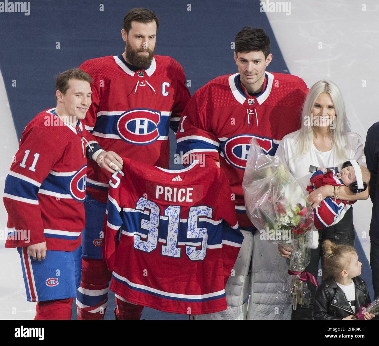 Montreal Canadiens players, including captain Shea Weber, bottom left,  Brendan Gallagher, second from bottom left, and Carey Price, fourth from  bottom left, give their condolences to the family of Montreal Canadiens  great