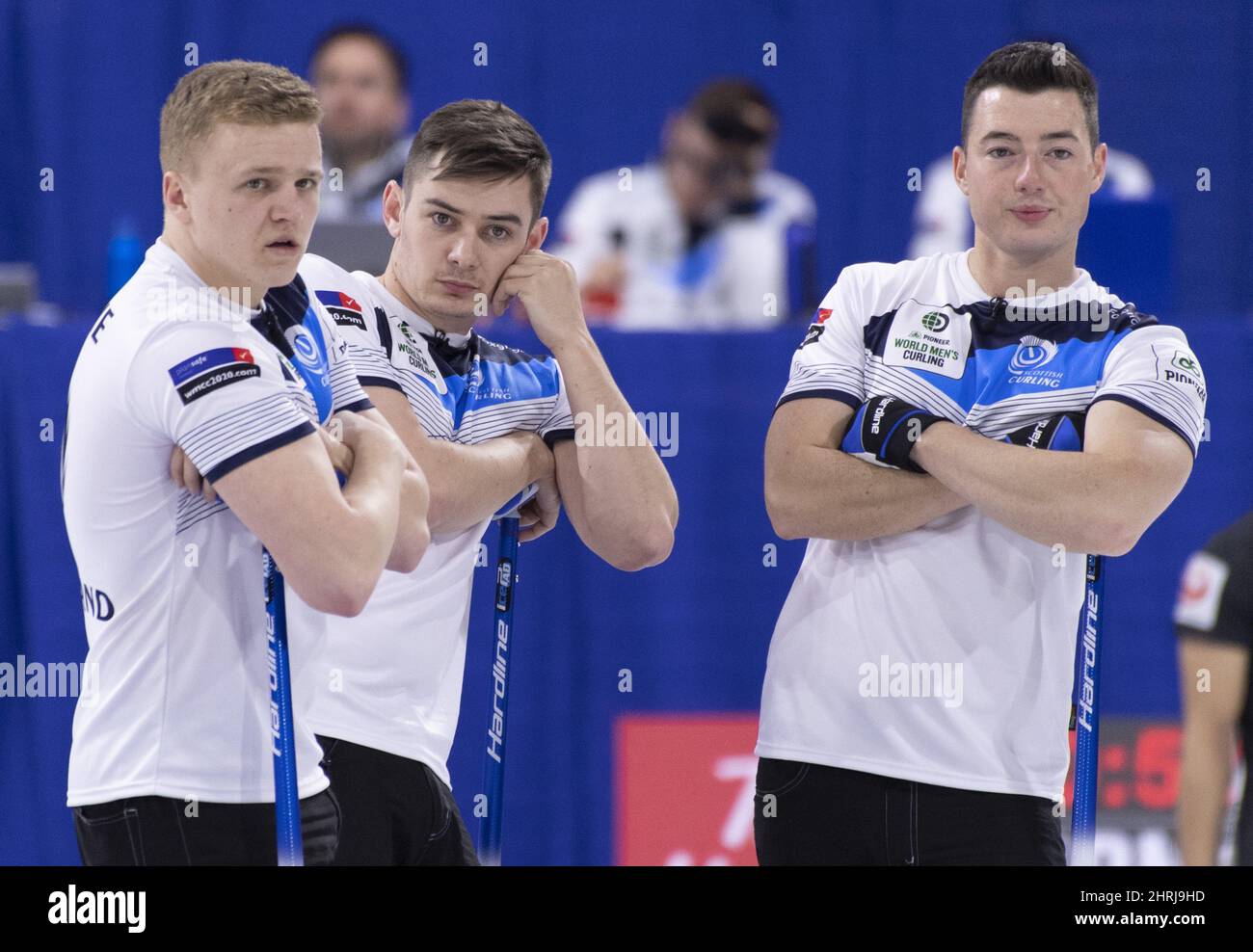 Scotland second Bobby Lammie, third Grant Hardie, lead Hammy McMillan, left to right, watch Japan set up their next shot at the world mens curling championship in Lethbridge, Alta