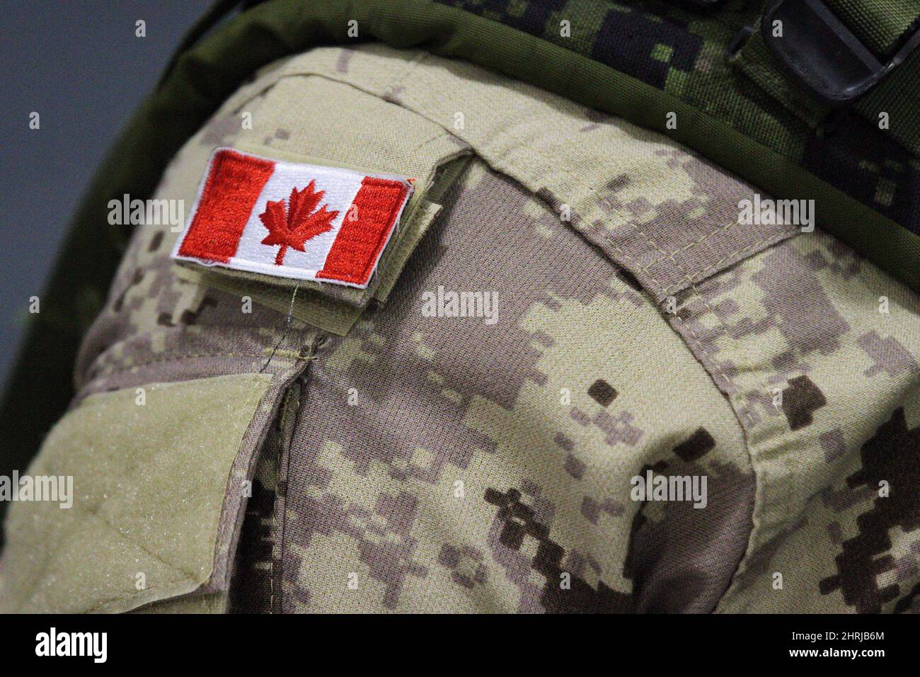 A Canadian flag patch is shown on a soldier's shoulder in Trenton, Ont., on Thursday, Oct. 16, 2014. The Canadian military isn't letting its hair down just yet, but for the first time, women in uniform will be allowed to wear ponytails. THE CANADIAN PRESS/Lars Hagberg Stock Photo
