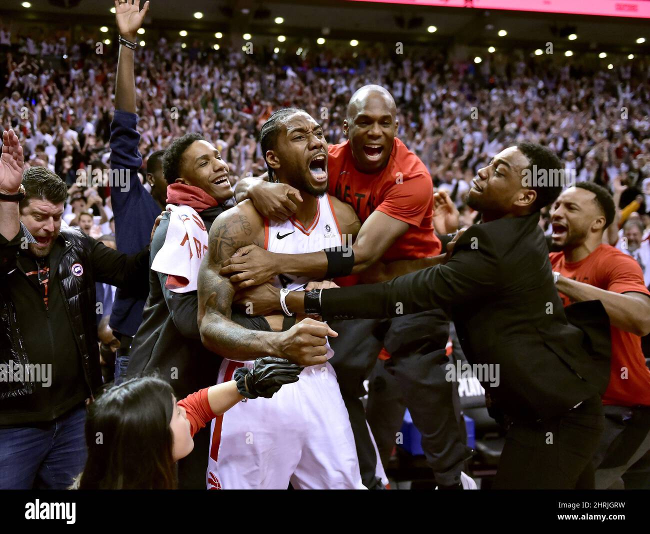 Toronto Raptors forward Kawhi Leonard (2) celebrates his last-second basket with teammates at the end of second half NBA Eastern Conference semifinal action against the Philadelphia 76ers, in Toronto on Sunday, May 12, 2019. THE CANADIAN PRESS/Frank Gunn Stock Photo