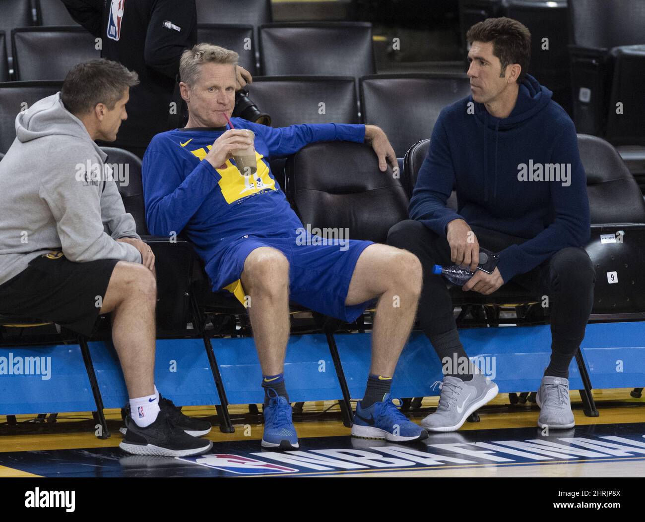 Golden State Warriors (left to right) Director of Sports Medicine Dr. Rick Celebrini, coach Steve Kerr and general manager Bob Myers talk at practice for NBA Finals in Oakland on Thursday June 6, 2019. THE CANADIAN PRESS/Frank Gunn Stock Photo