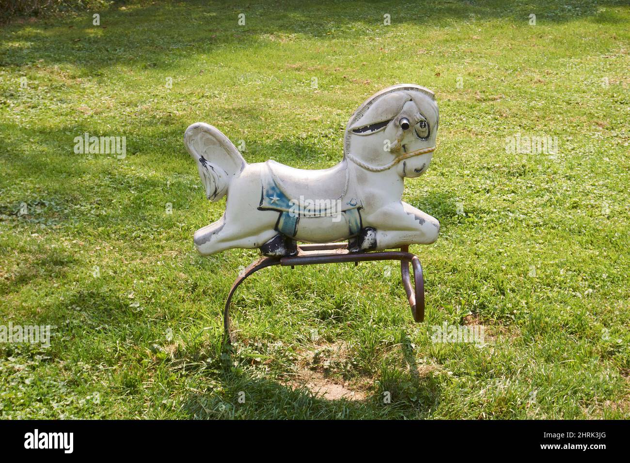 Old rocking horse playground equipment Stock Photo Alamy