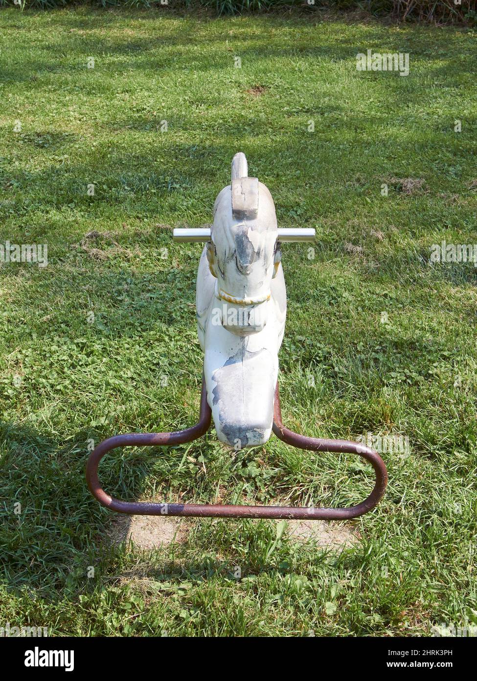 Old rocking horse playground equipment Stock Photo Alamy