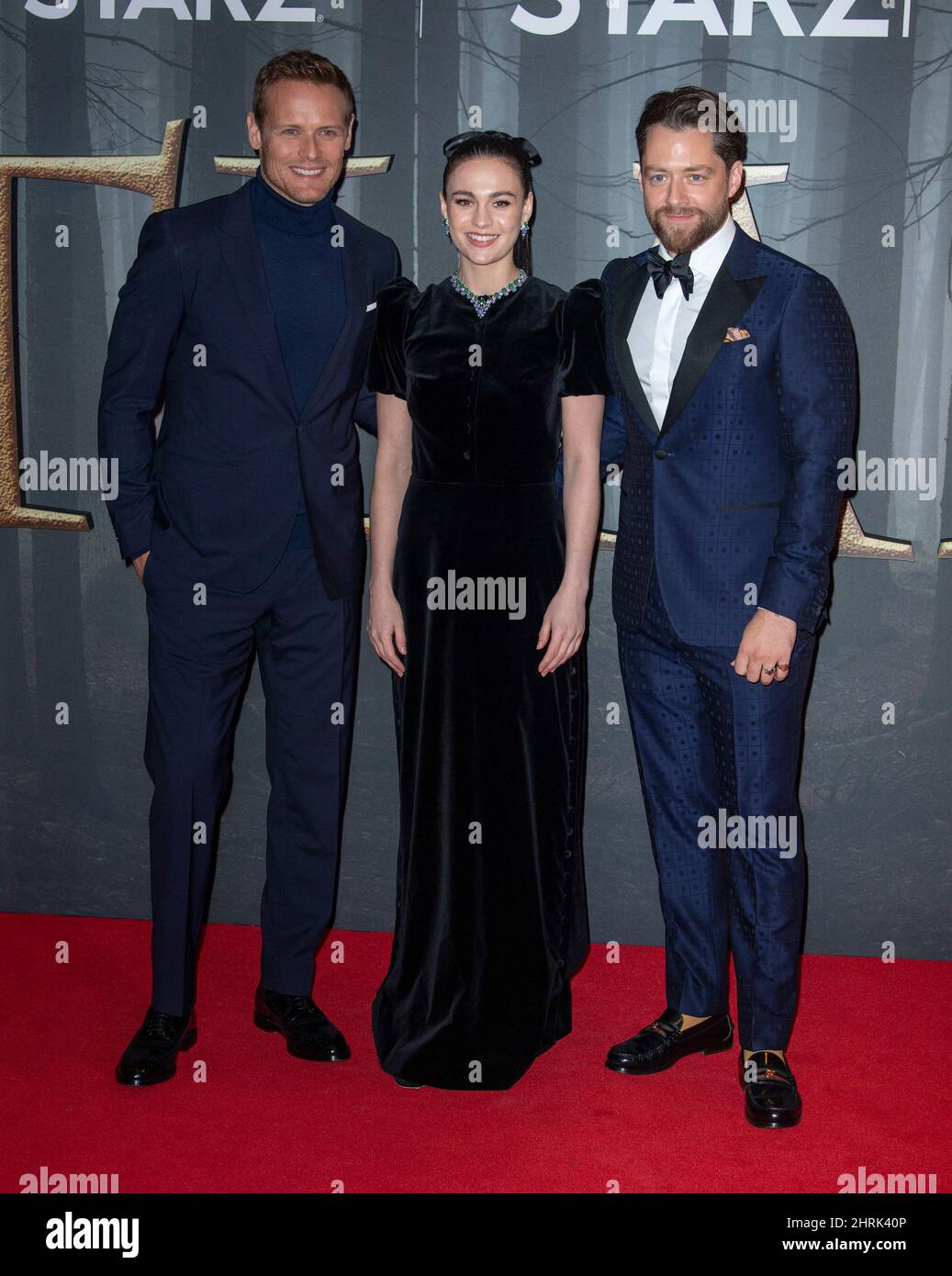 LONDON, ENGLAND - FEBRUARY 24:  Sam Heughan, Sophie Skelton and Richard Rankin attend the UK Premiere of 'Outlander' Season Six at The Royal Festival Stock Photo