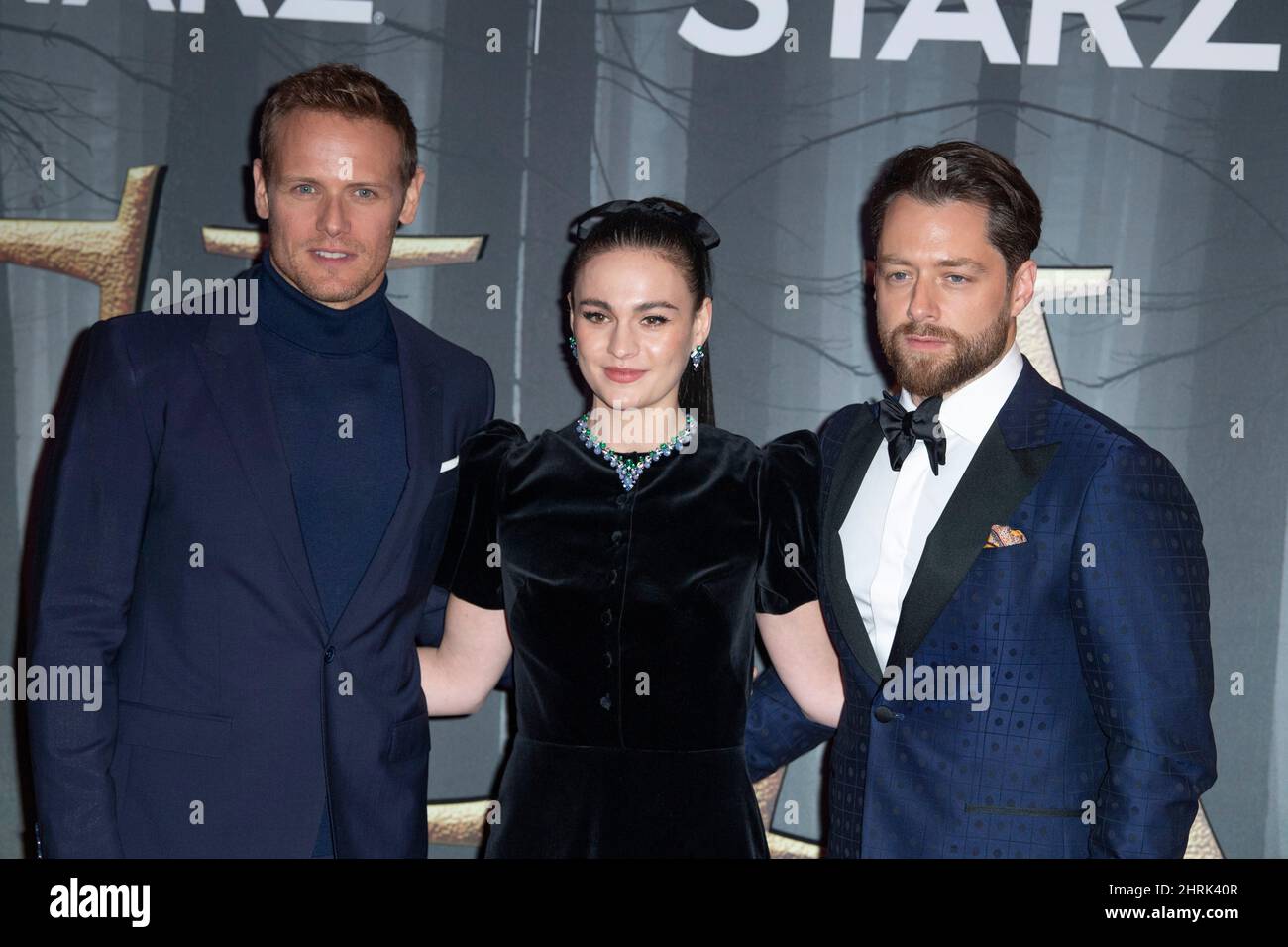 LONDON, ENGLAND - FEBRUARY 24:  Sam Heughan, Sophie Skelton and Richard Rankin attend the UK Premiere of 'Outlander' Season Six at The Royal Festival Stock Photo