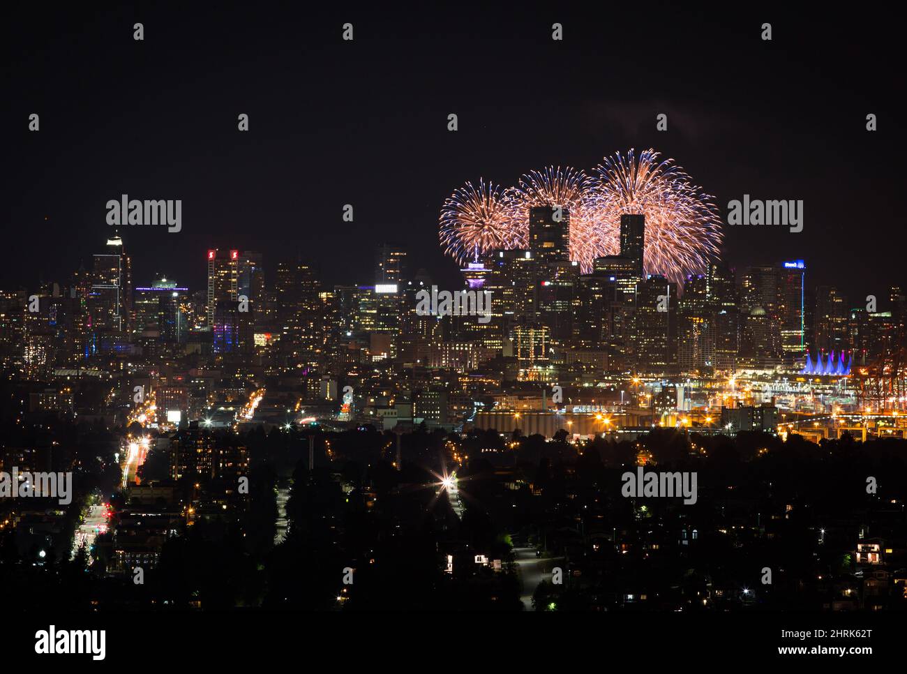 Seen from Burnaby Mountain approximately 16 kilometres away, fireworks explode behind the downtown Vancouver skyline as a pyrotechnic team from Croatia closes out the final night of the Honda Celebration of Light, in Vancouver, on Saturday August 3, 2019. Teams from India, Canada and Croatia competed over three nights shooting off shells from a barge on English Bay at the annual international fireworks festival that draws crowds of hundreds of thousands of people to watch each night. THE CANADIAN PRESS/Darryl Dyck Stock Photo