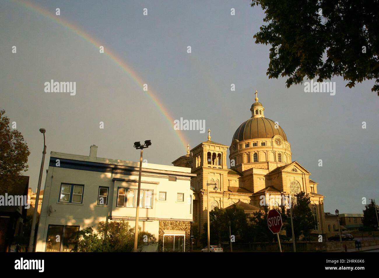Rainbow in Lincoln Village over the Basilica of St. Josaphat in Milwaukee, Wisconsin. Stock Photo