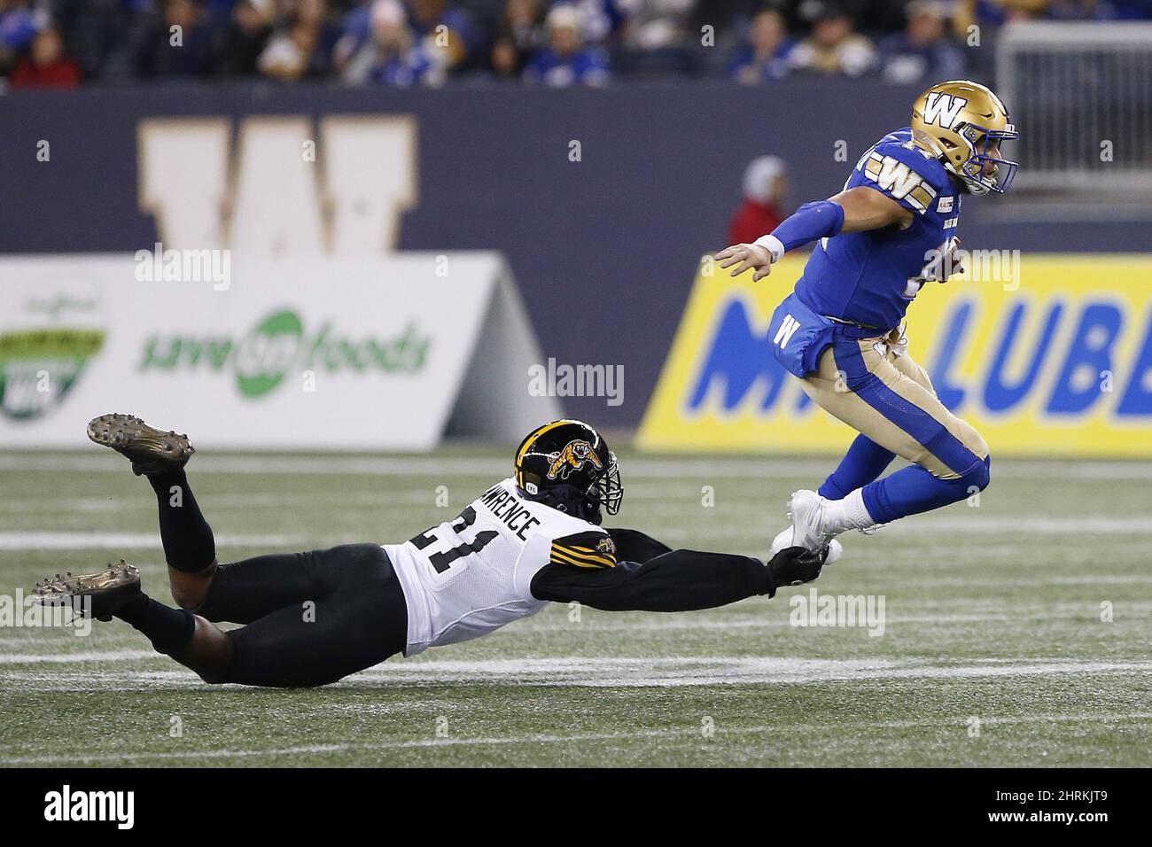 Winnipeg Blue Bombers quarterback Chris Streveler (17) gets tackled ...