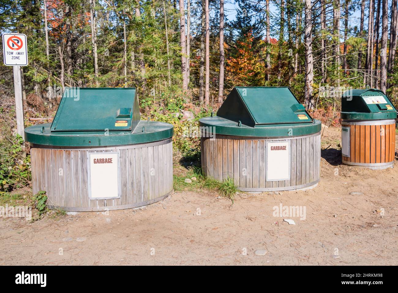 Waste containers in a waste dump in the countryside on a sunny autumn day Stock Photo