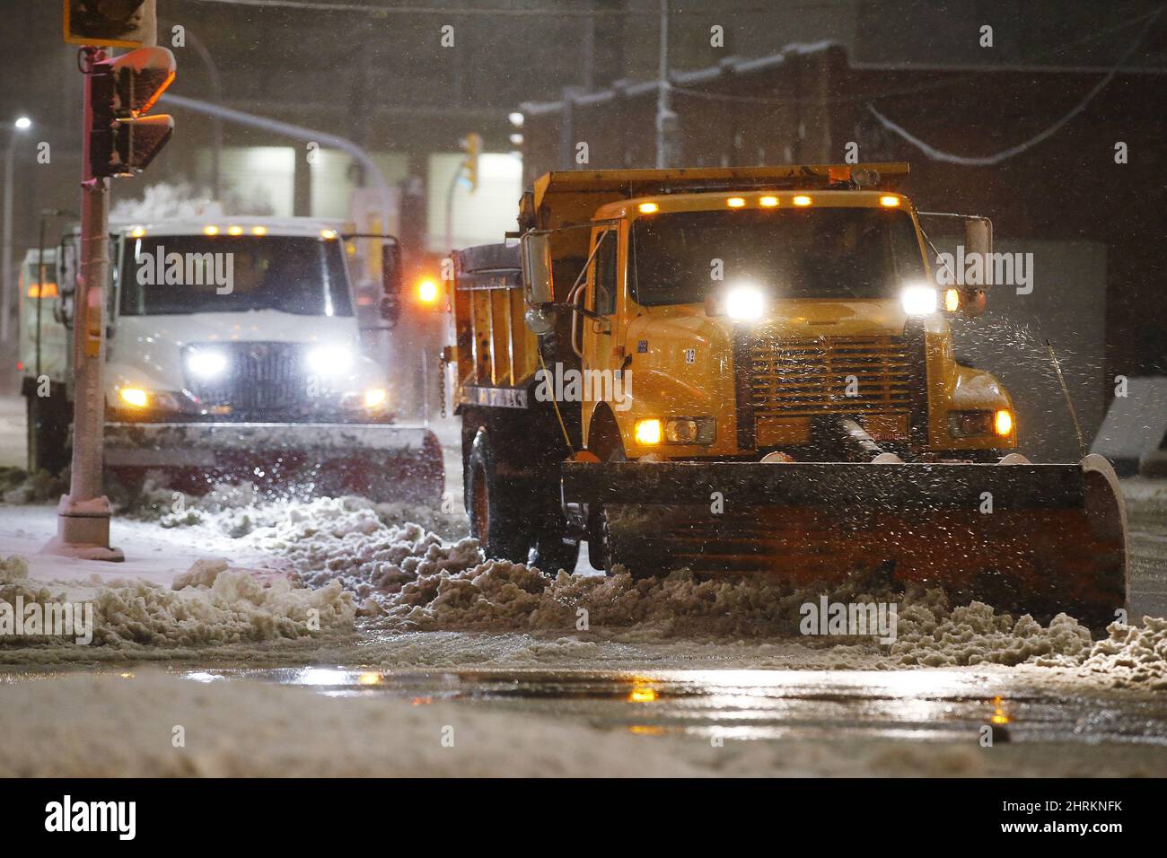 Crews cleanup during an early winter storm with heavy wet snow which ...