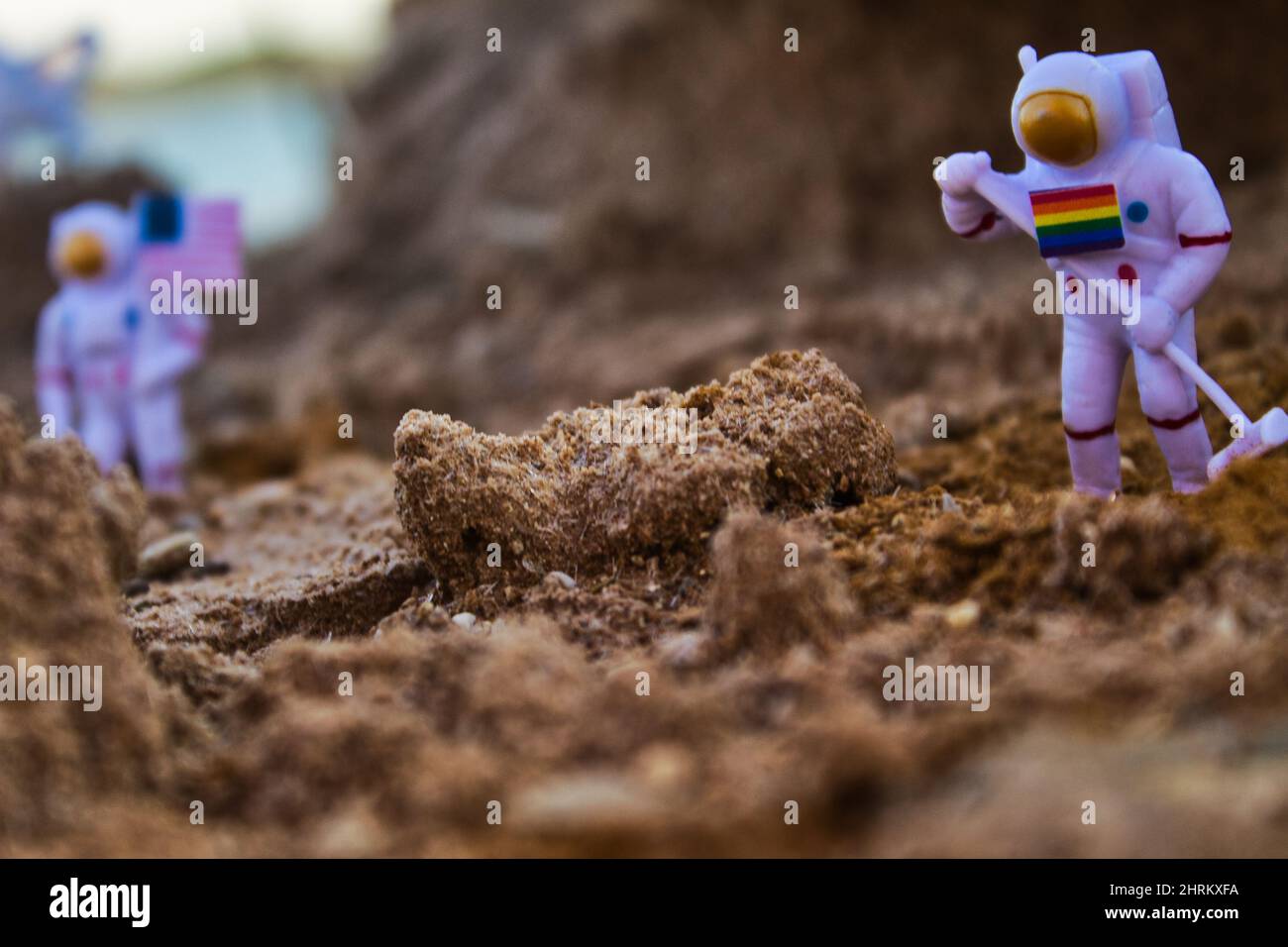 Selective focus shot of an astronaut gay miniature arrival on the planet Stock Photo