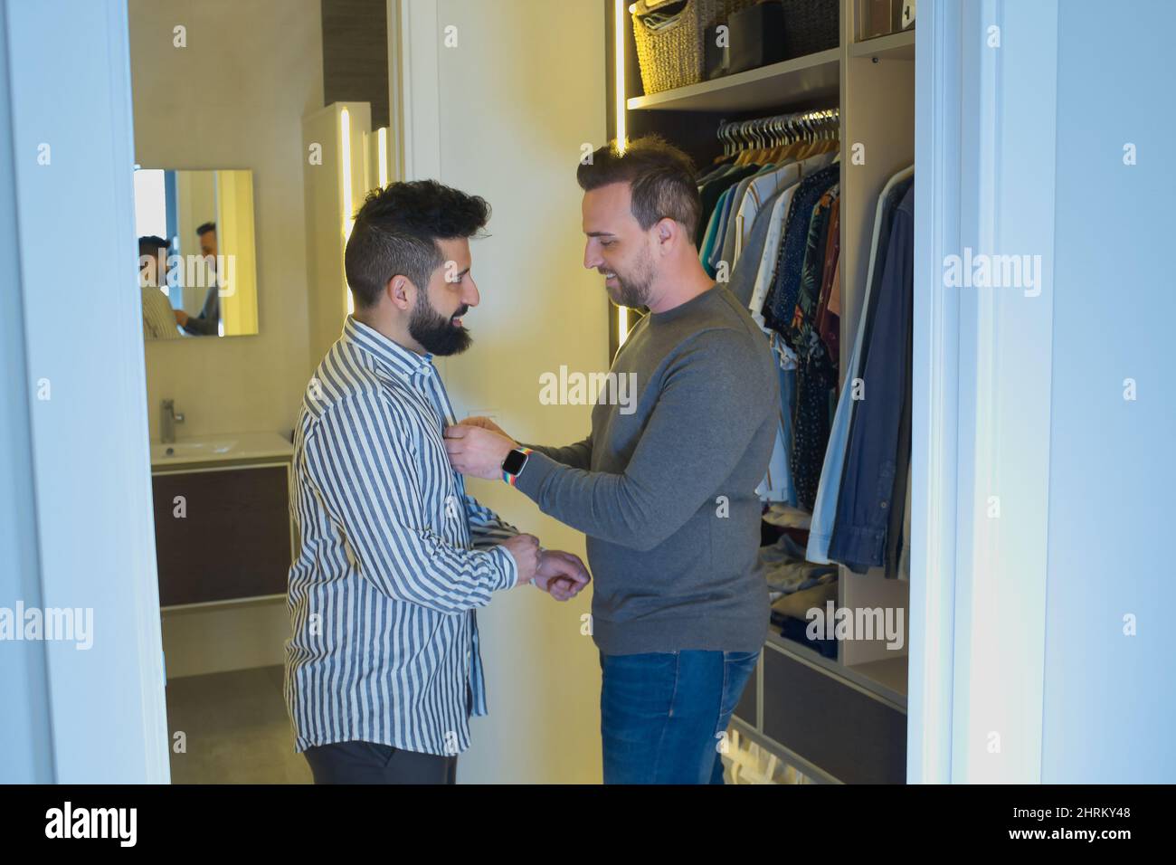 Closeup of a Gay married couple getting dressed inside the dressing room Stock Photo