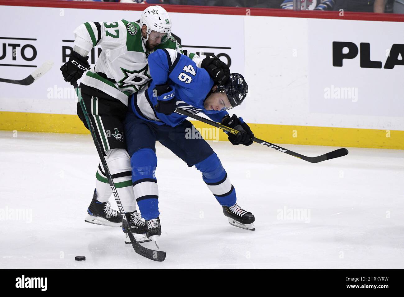 Winnipeg Jets' Joona Luoto (46) is checked by Dallas Stars' Justin Downling (37) during first period NHL action in Winnipeg on Sunday, Nov. 10, 2019. THE CANADIAN PRESS/Fred Greenslade Stock Photo