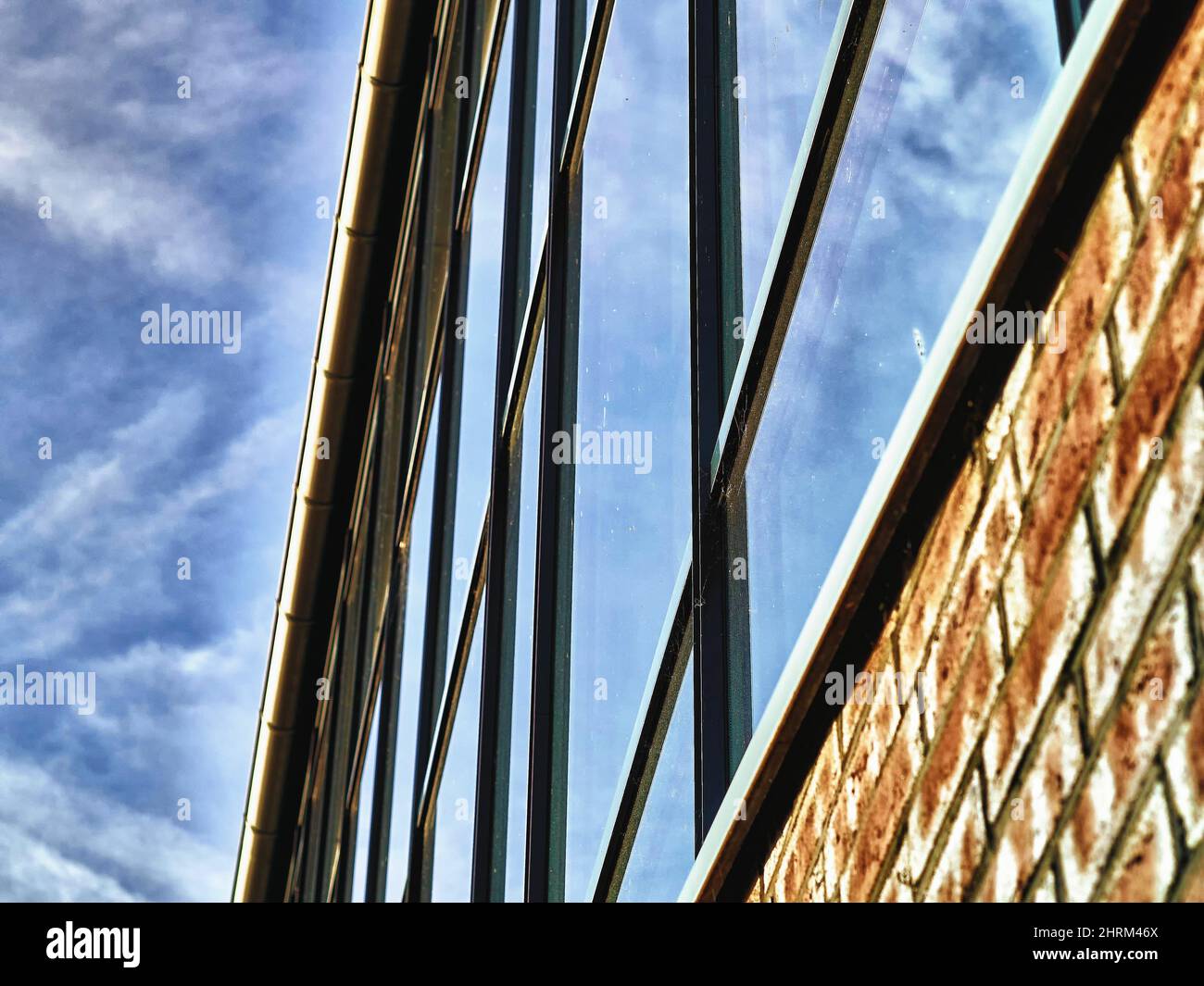 Low angle shot of modern glass windows of a building Stock Photo - Alamy