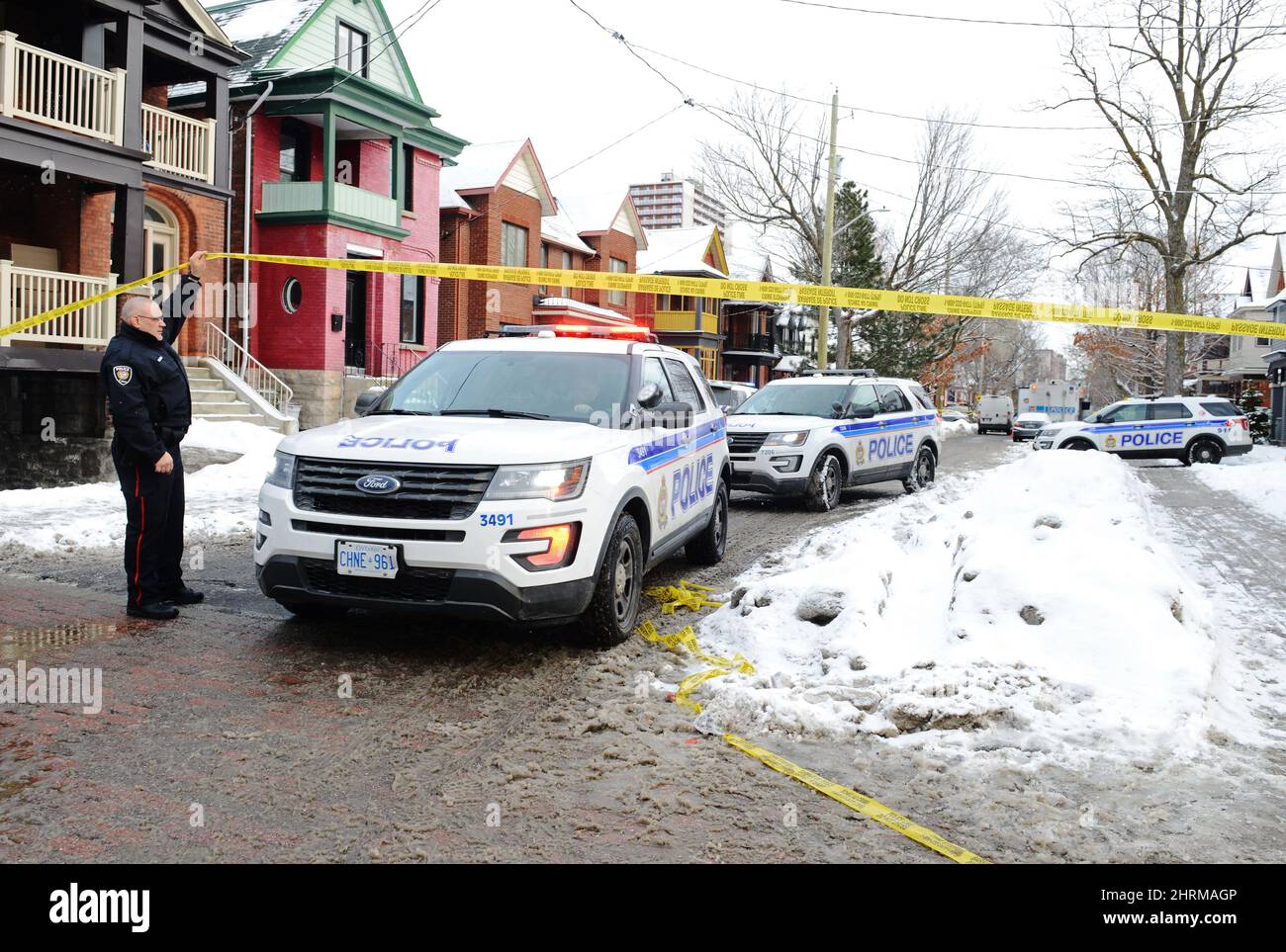 Police inspect the scene of a shooting in downtown Ottawa on Wednesday ...