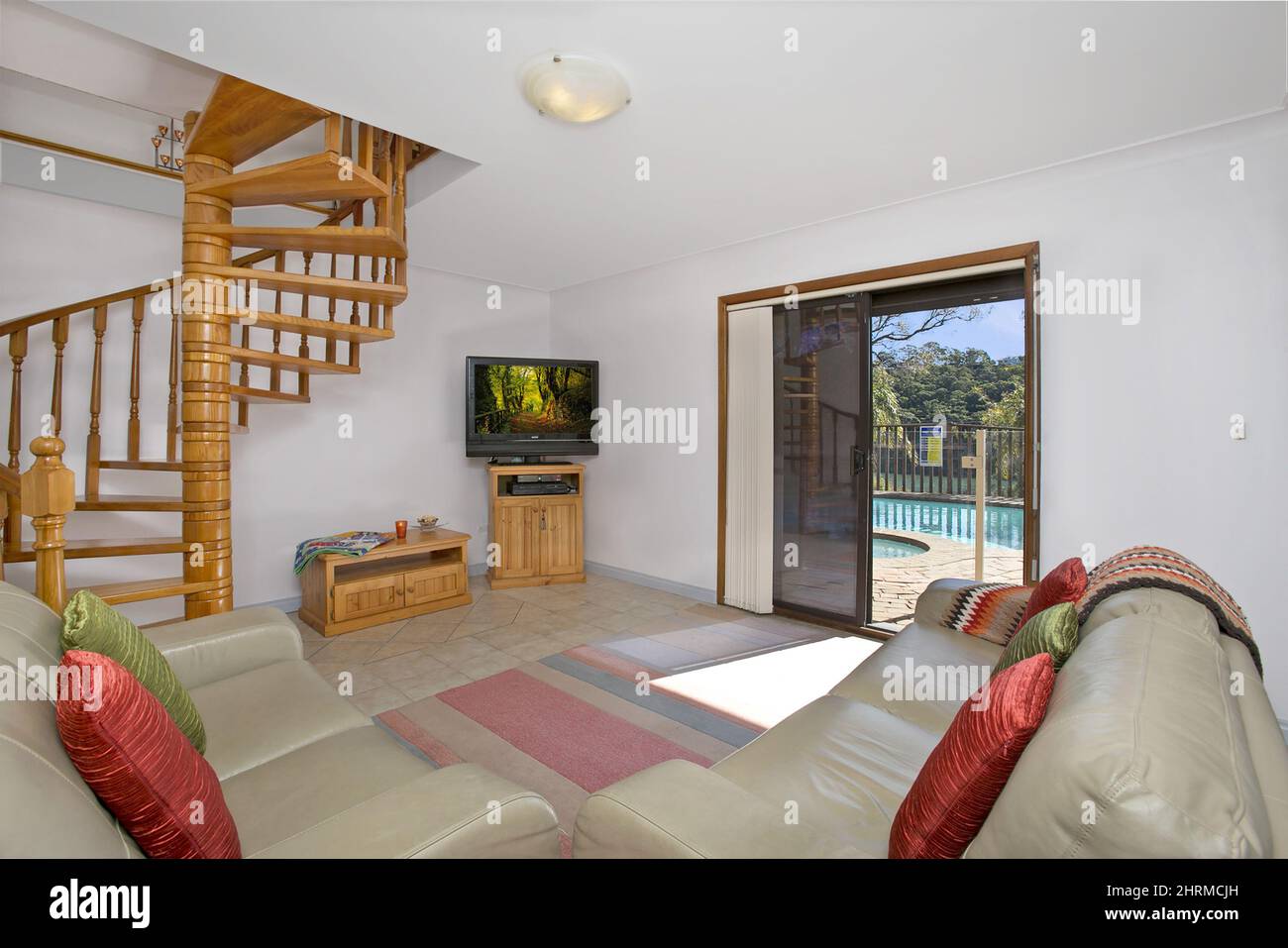 Living room interior with a view of the pool Stock Photo - Alamy