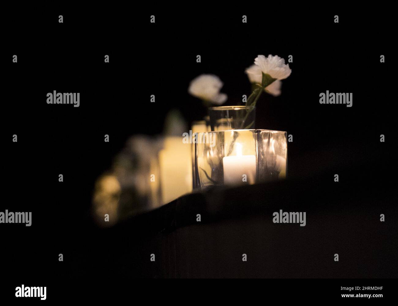 Candles burn during a ceremony in Montreal, Sunday, Jan. 19, 2020, to