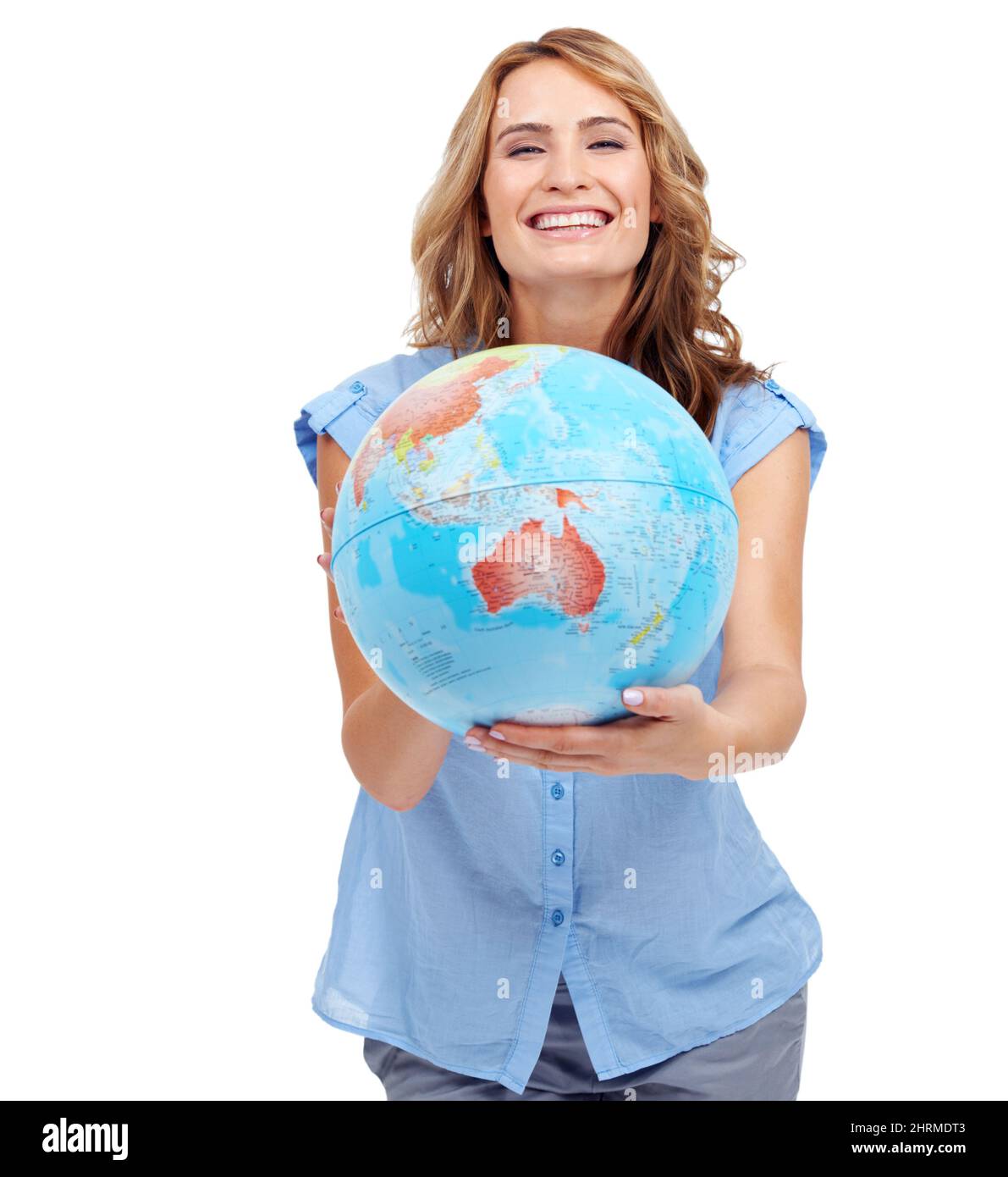 A world to explore. A pretty young woman showing you Australia on a world globe. Stock Photo