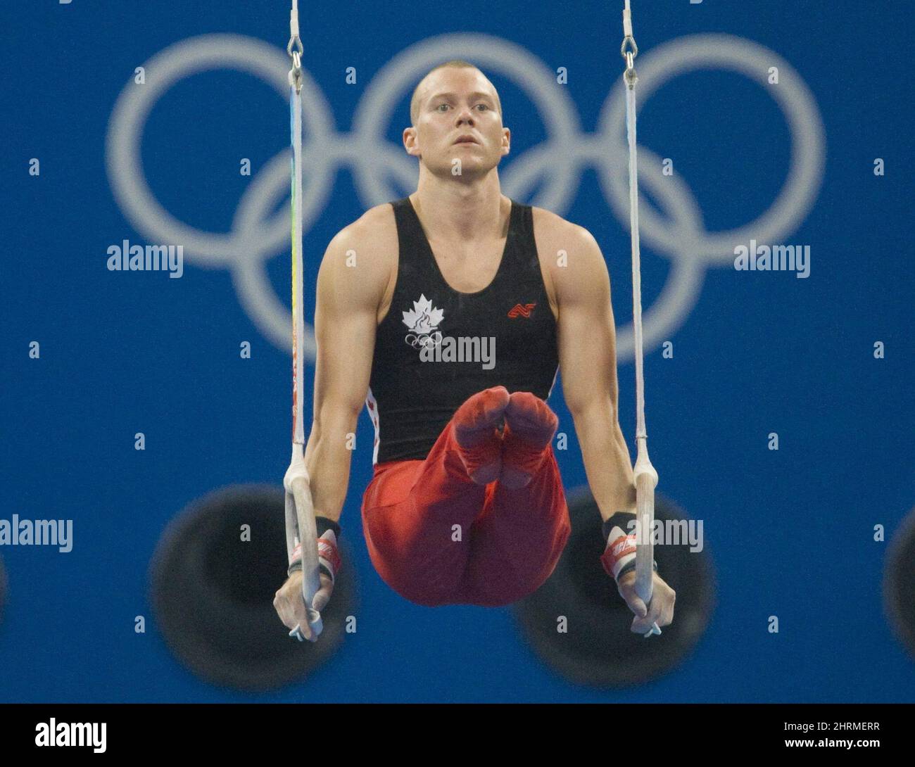 Canadian Kyle Shewfelt, from Calgary, competes on the rings during the