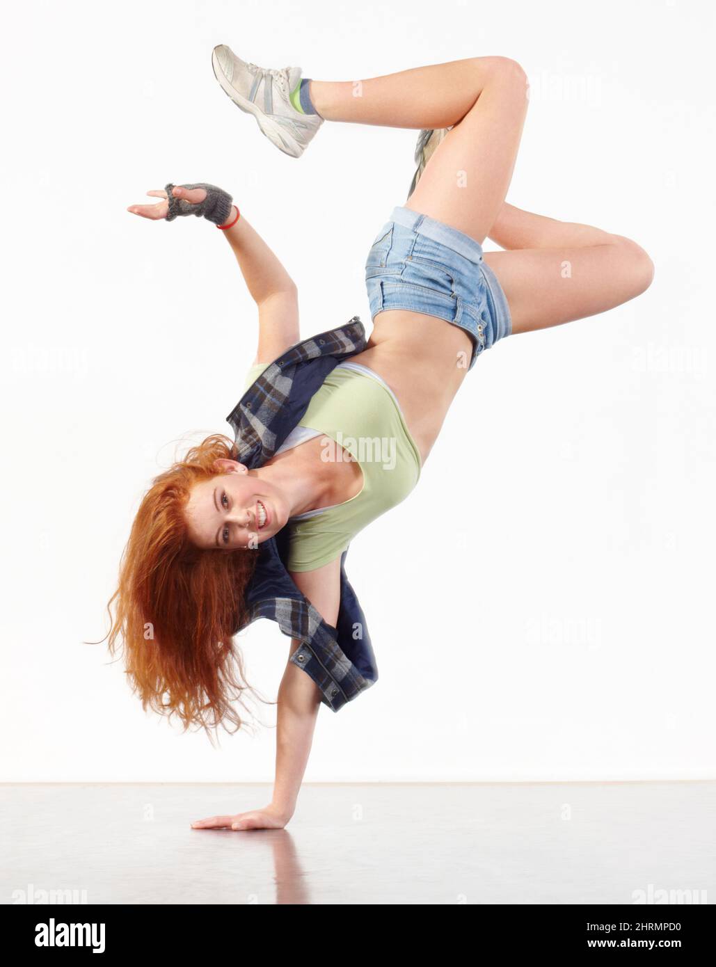 In the zone. Young woman doing hip hop dancing against a white background. Stock Photo