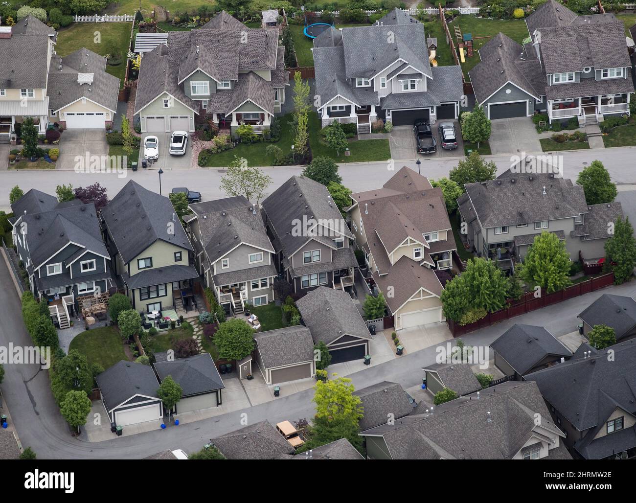 Houses are seen in an aerial view in Langley, B.C., on Wednesday May 16, 2018. A pair of Canadian start-ups are looking to help make it easier to buy homes and cars using technology by speeding the mortgage approval process and by making finding and buying a new ride faster. THE CANADIAN PRESS/Darryl Dyck Stock Photo