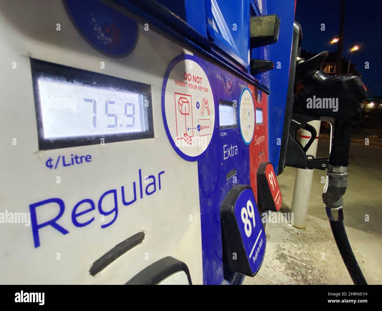 A pump shows the price per litre for regular gas at a gas station in