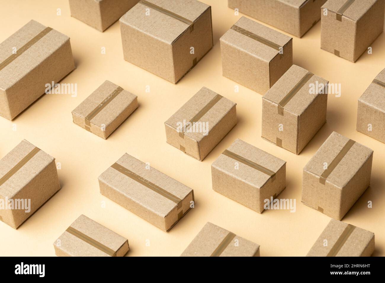 Lots of cardboard boxes pattern on brown background. Stock Photo
