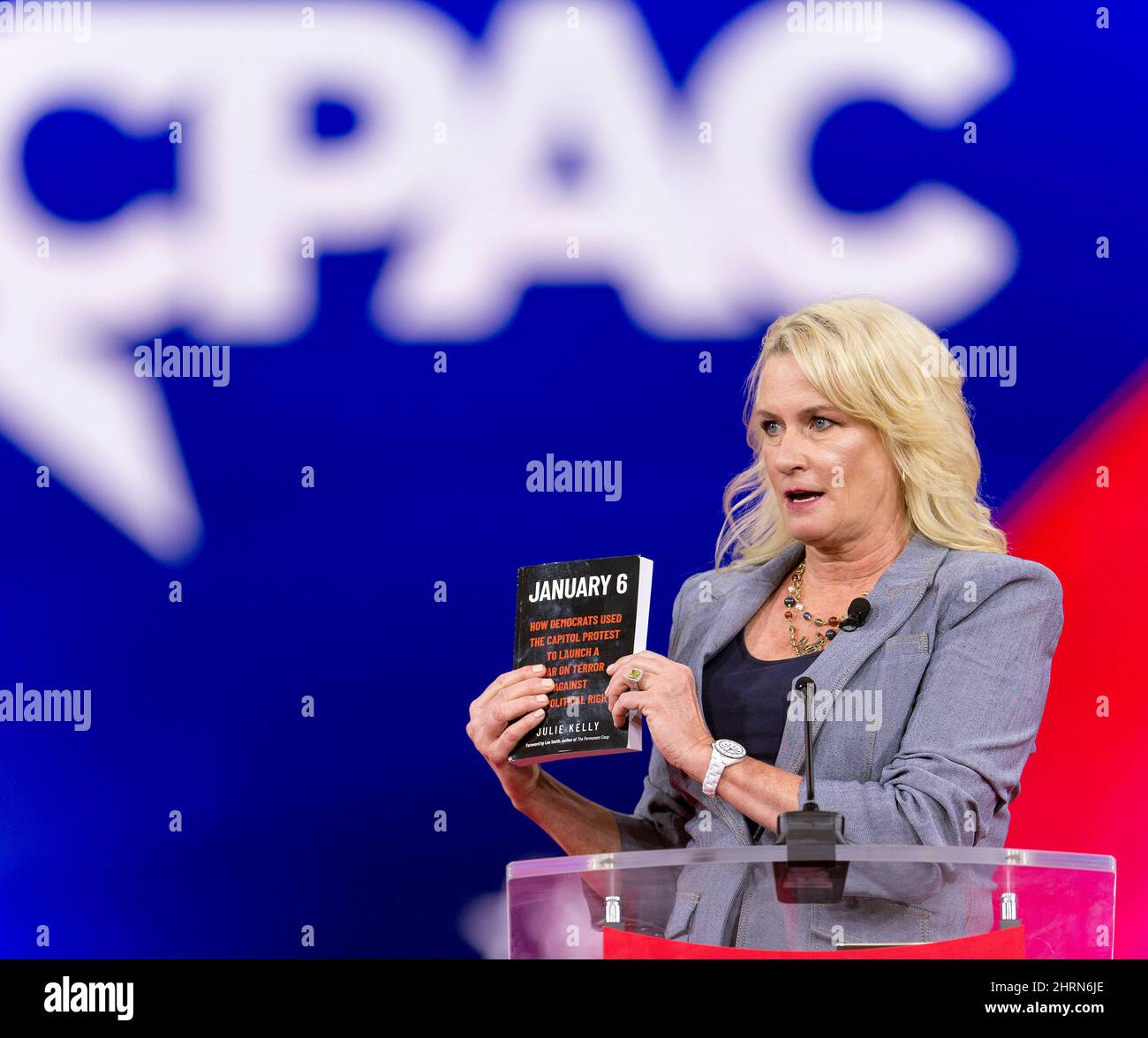 Orlando, Florida, USA. 25th Feb, 2022. JULIE KELLY hawks her book during a speech at the 2022 Conservative Political Action Conference, CPAC.(Credit Image: © Brian Cahn/ZUMA Press Wire) Credit: ZUMA Press, Inc./Alamy Live News Stock Photo