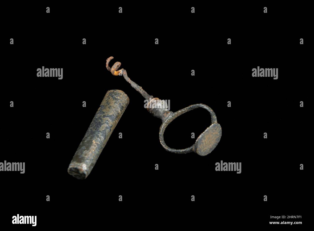 Vintage antique corkscrew on black background Stock Photo - Alamy