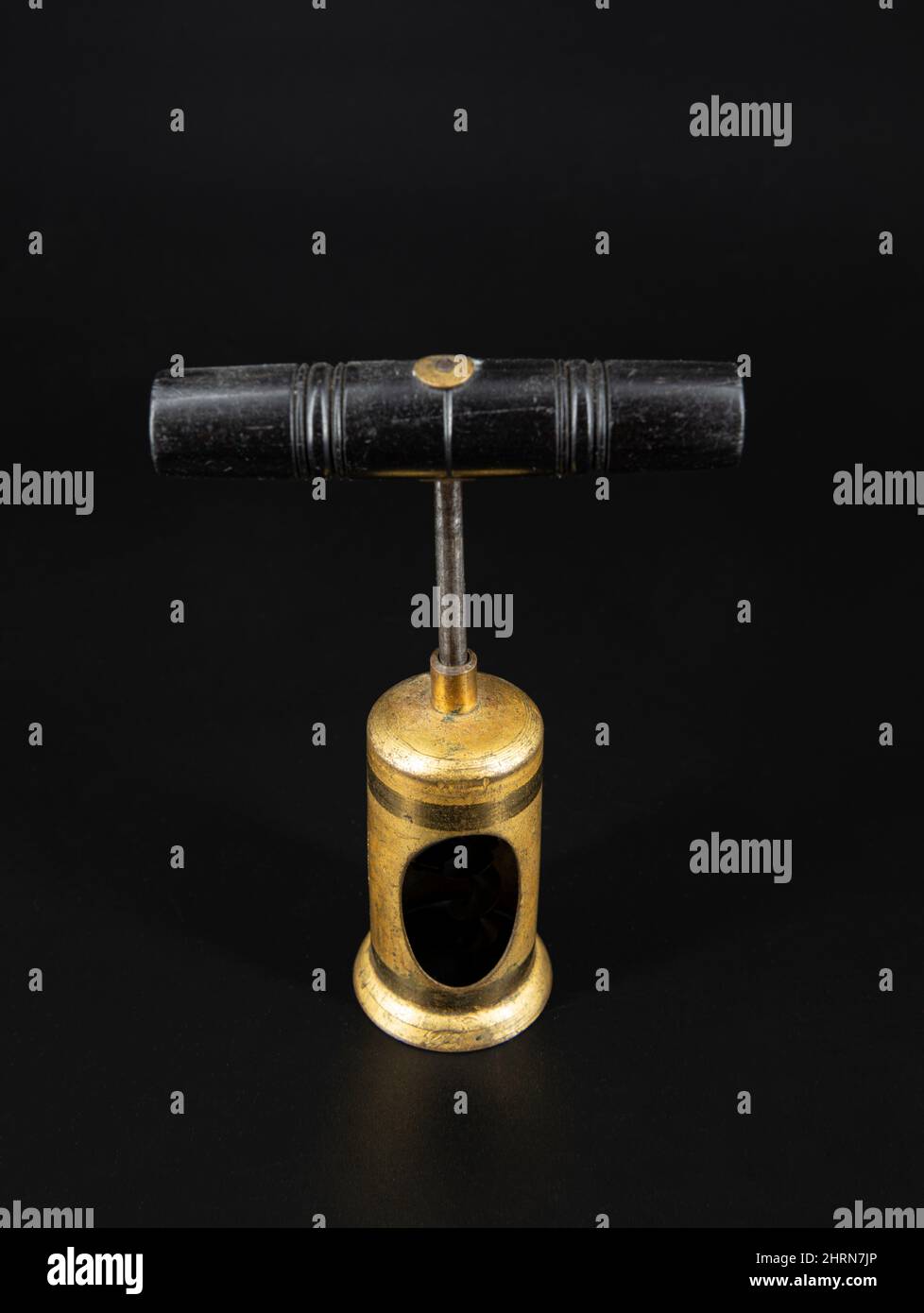 Vintage antique corkscrew on black background Stock Photo - Alamy