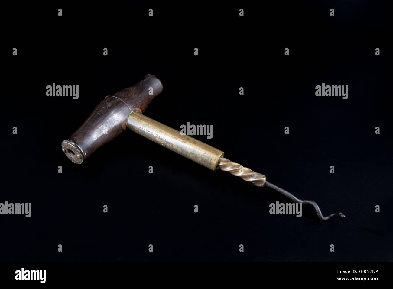Vintage antique corkscrew on black background Stock Photo