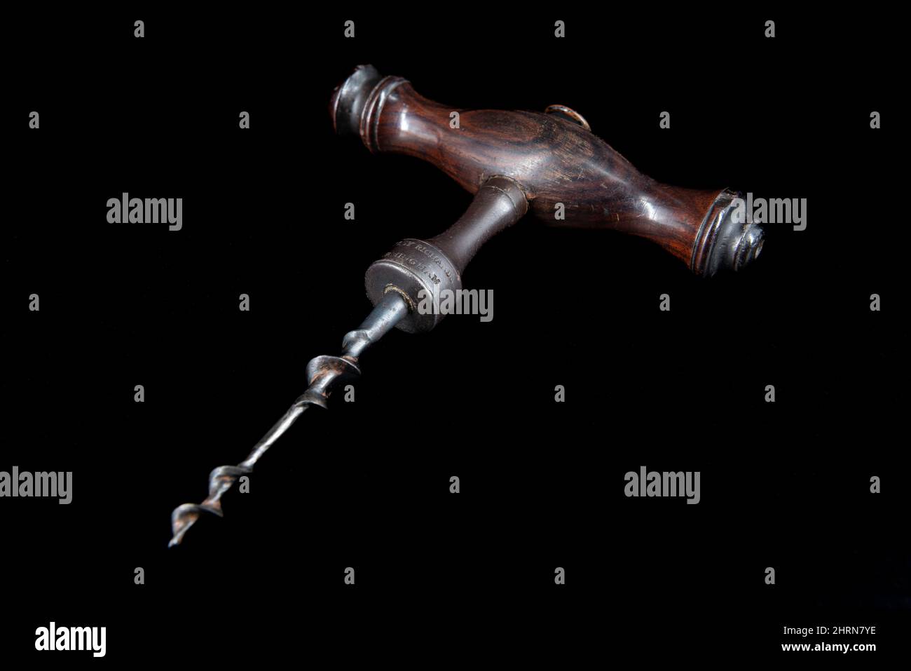Vintage antique corkscrew on black background Stock Photo - Alamy