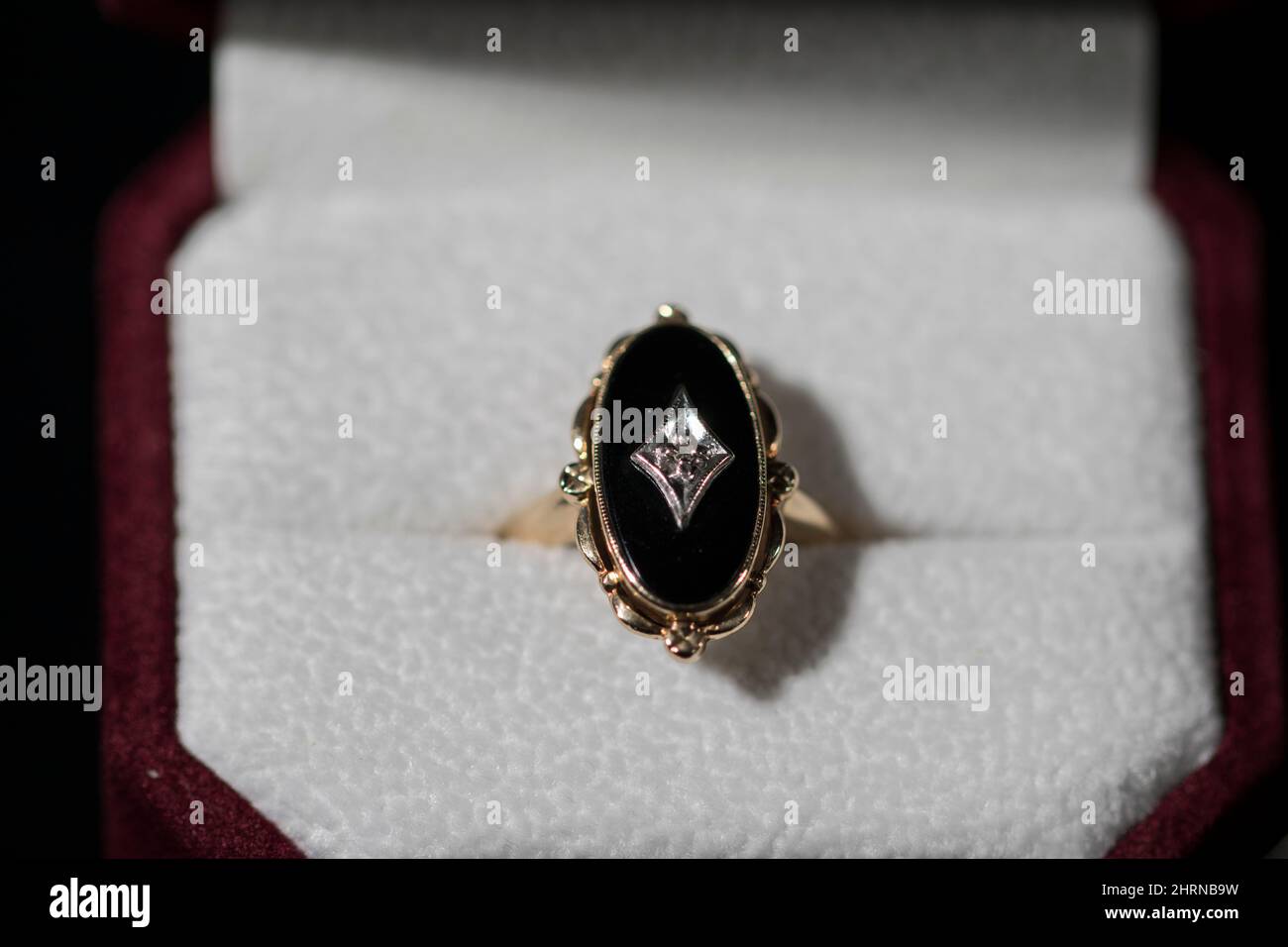 Black onyx gold diamond ring. Close up vintage wedding ring black onyx diamond ring. Stock Photo