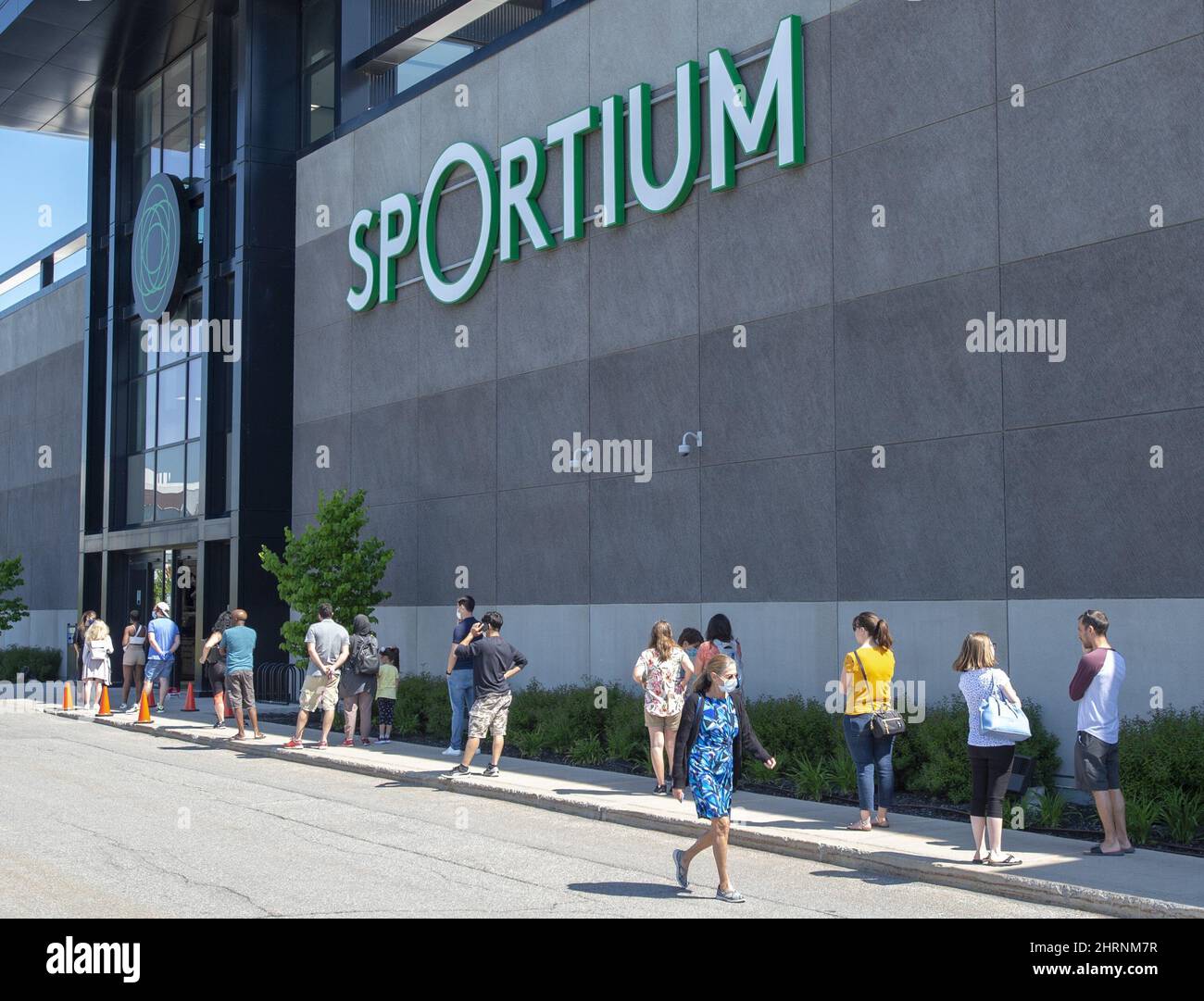 Customers lineup at a Sportium store Friday, June 5, 2020 in Laval
