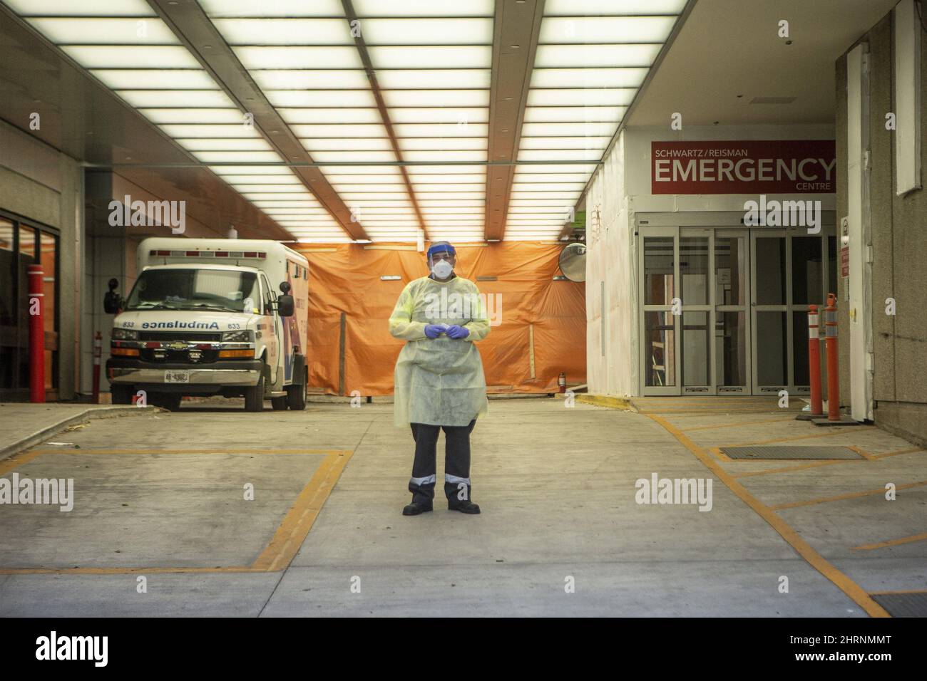 A paramedic stands in the ambulance bay of Mount Sinai Hospital in ...