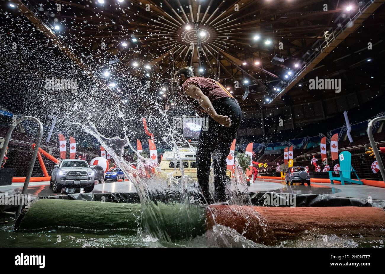 Scott Thompson, of West Coast Lumberjack Shows, performs log rolling during a drive thru Canada
