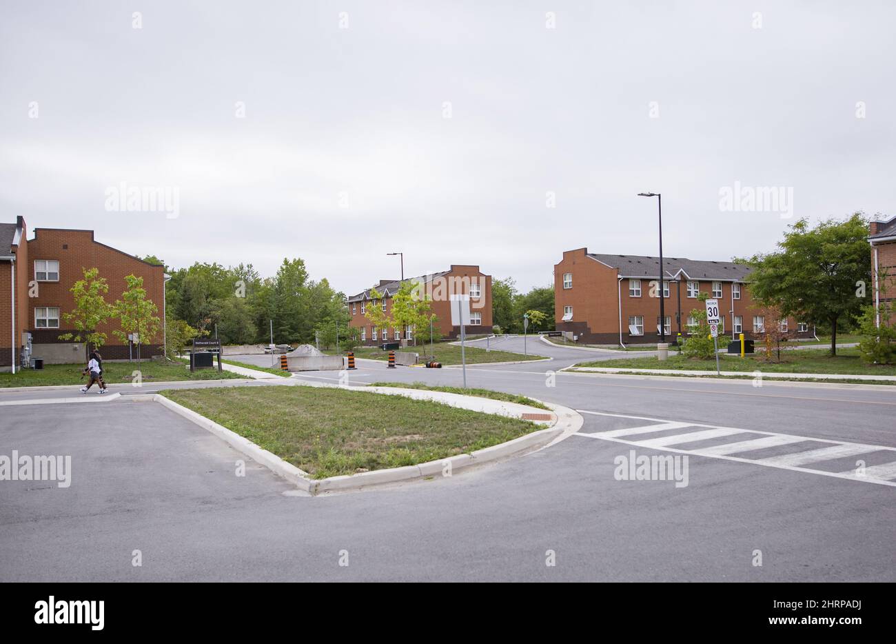 Brock University students walk through the Village Residence complex on campus in St. Catharines