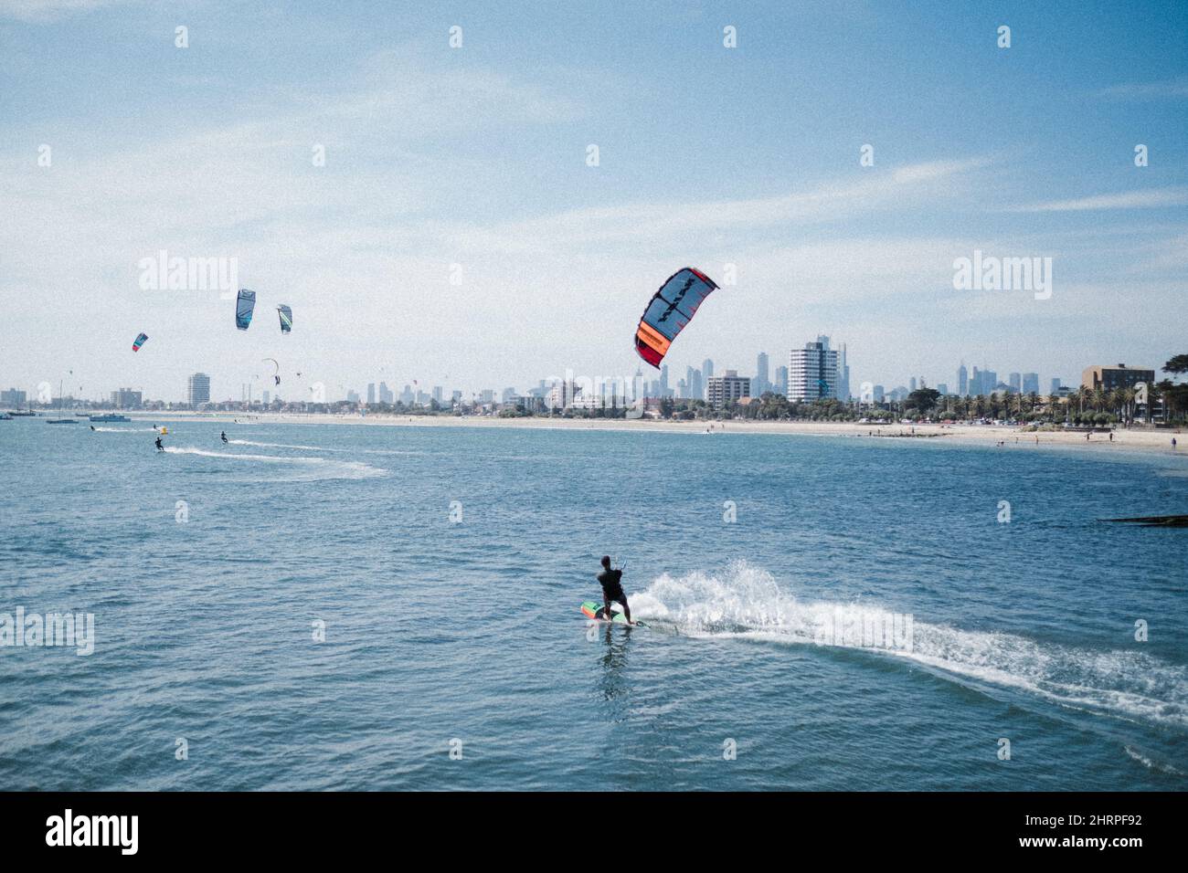 View of people kiteboarding in the port near Melbourne, Australia Stock